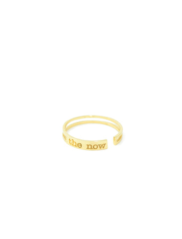 jewelry for this moment. the now.  a prominent 14K gold bar ring embossed with the now logo serves as a playful reminder to always raise the bar.
