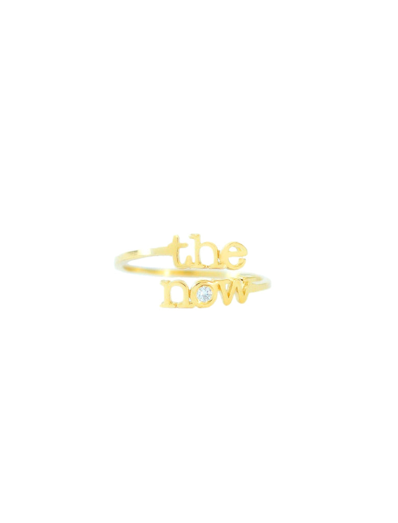 jewelry for this moment. the now.  The 14 karat gold ‘the now’ message, anchored by a shining diamond, encourages you to let go of whatever holds you back and to live in this moment - the now.