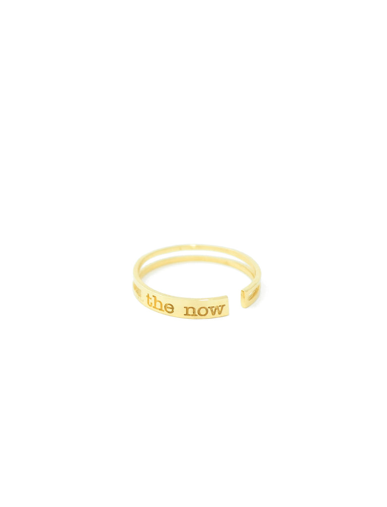 jewelry for this moment. the now.  a prominent 14K gold bar ring embossed with the now logo serves as a playful reminder to always raise the bar.